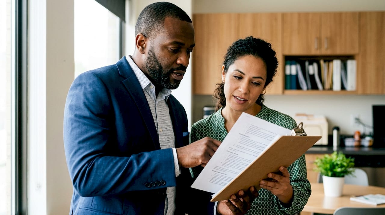 Recruiters reviewing candidate screening notes