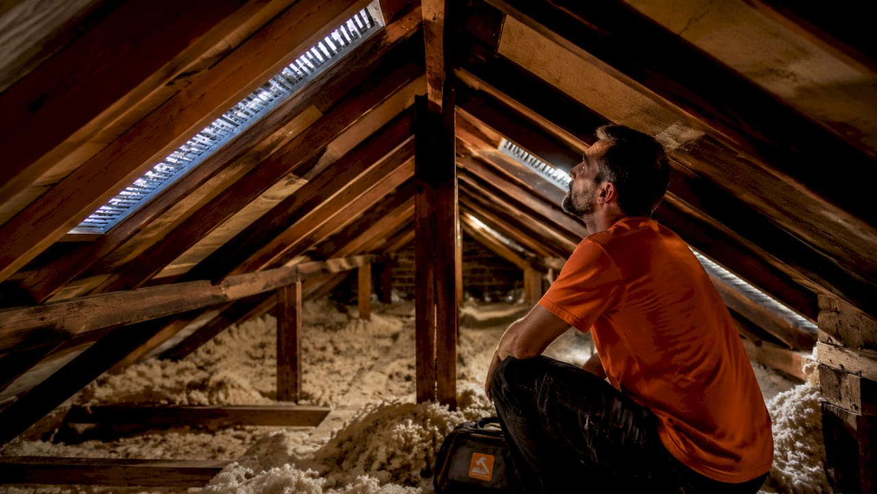 Close-up of soffit and ridge vents in attic