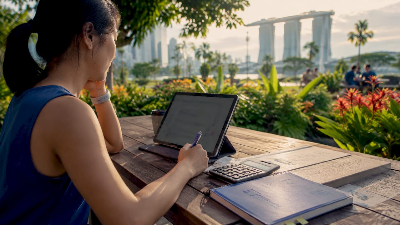 Tablet showing expense tracking app in Singapore office