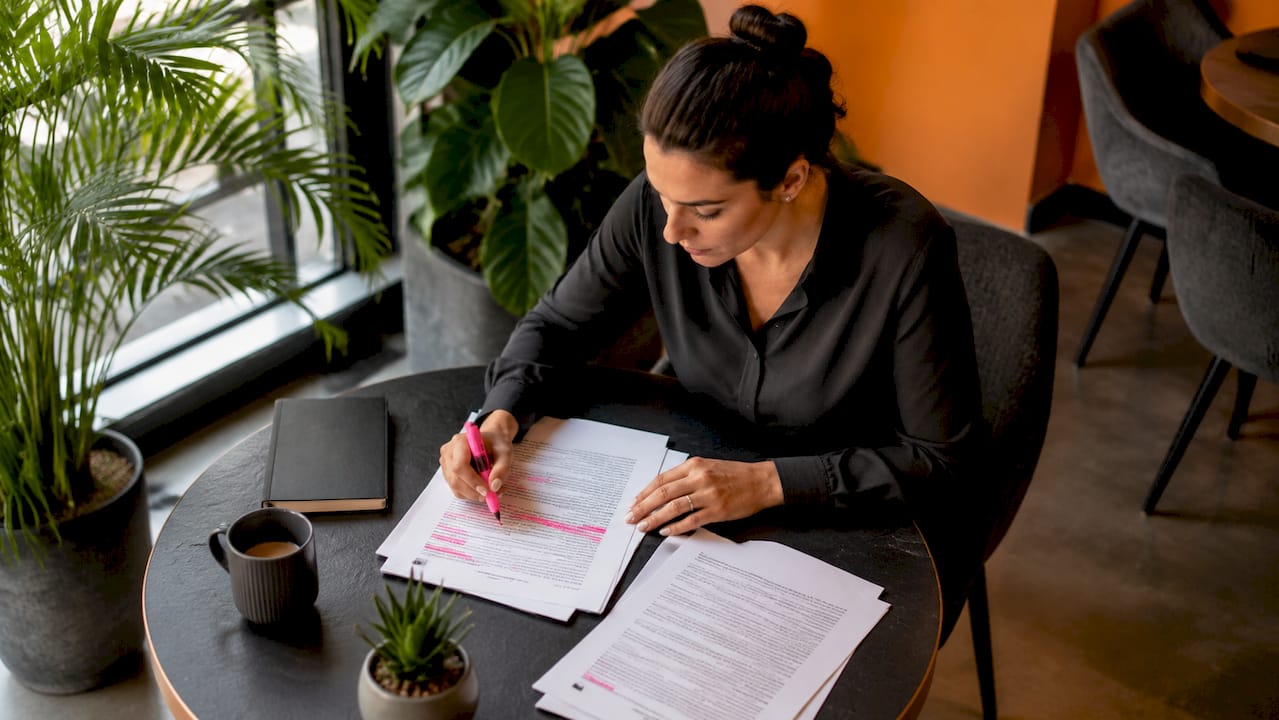 Woman reviewing transportation insurance documents