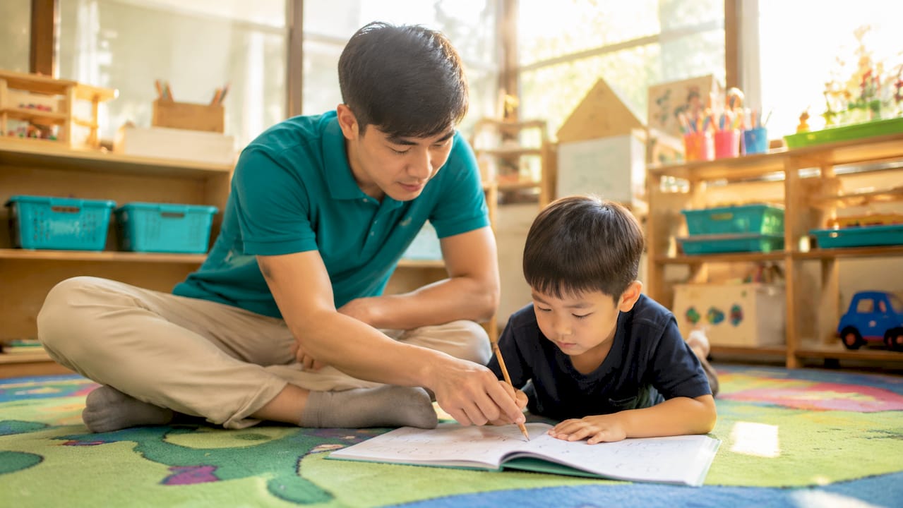 Teacher providing one-on-one preschool instruction