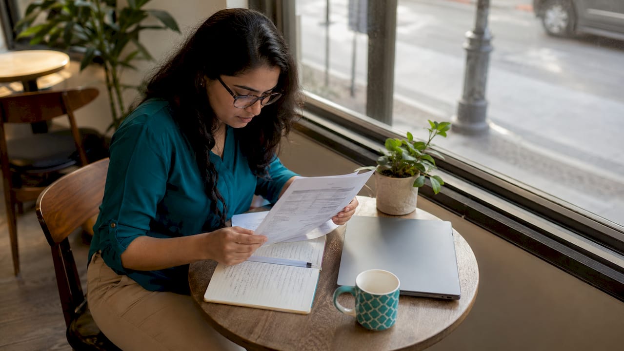 Woman reviewing international school fee documents