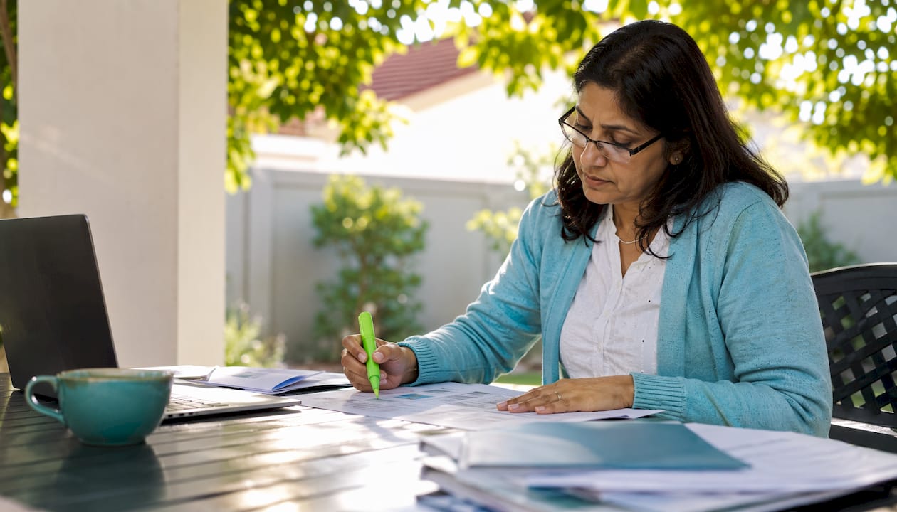Parent reviewing teaching quality materials at home