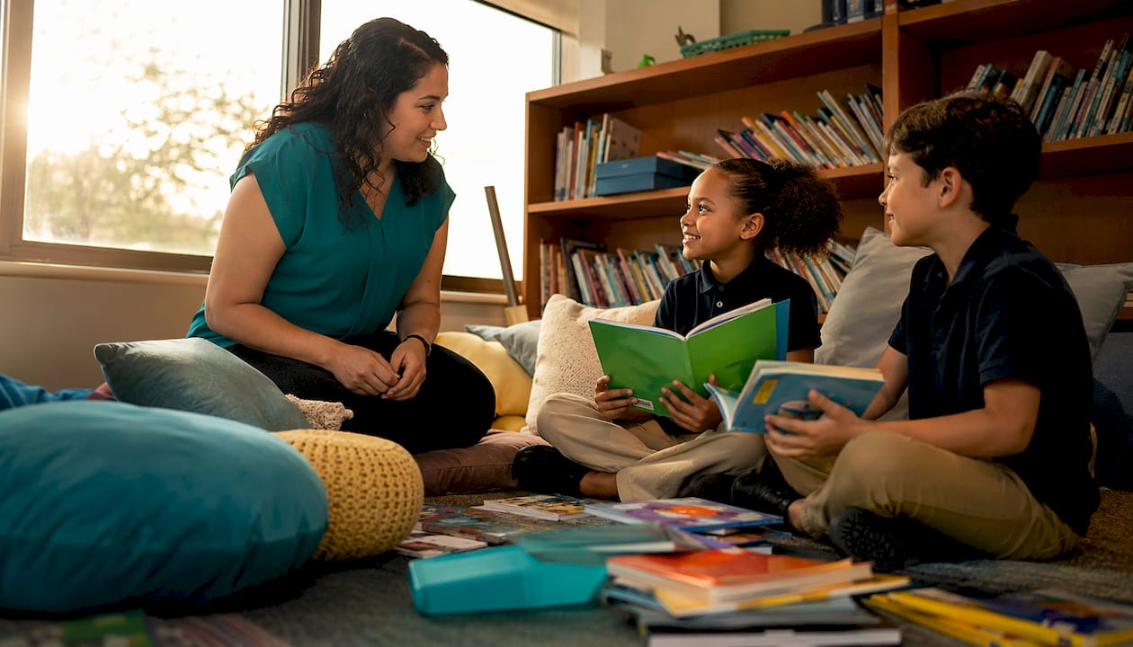 Teacher engaging small group of students in classroom