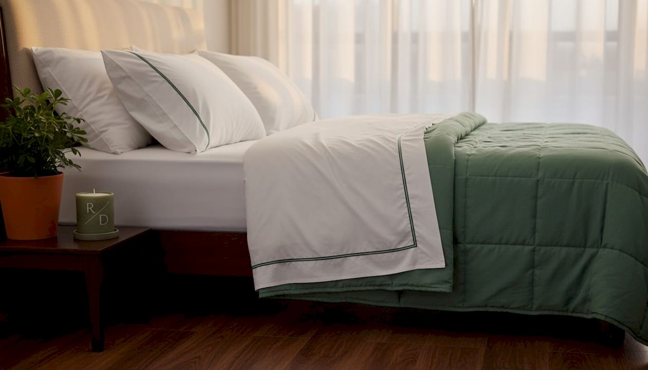 King-sized bed with hotel collection sheets