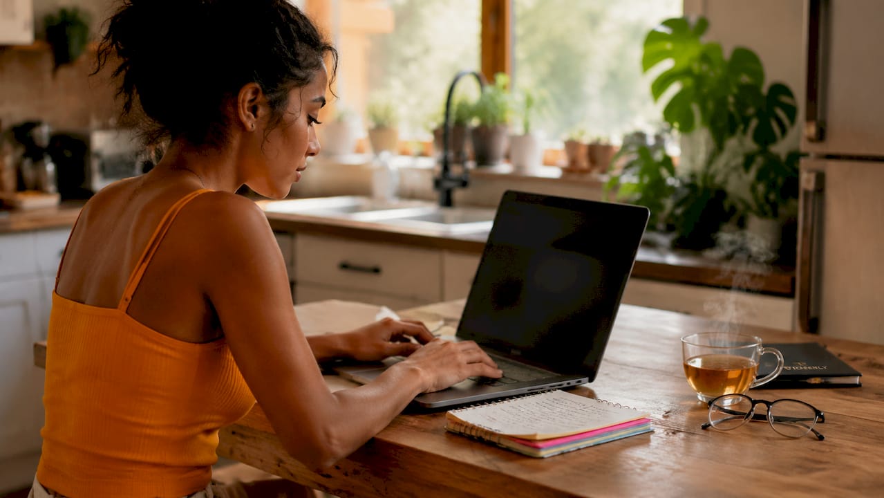 Young woman practicing demo trading at desk