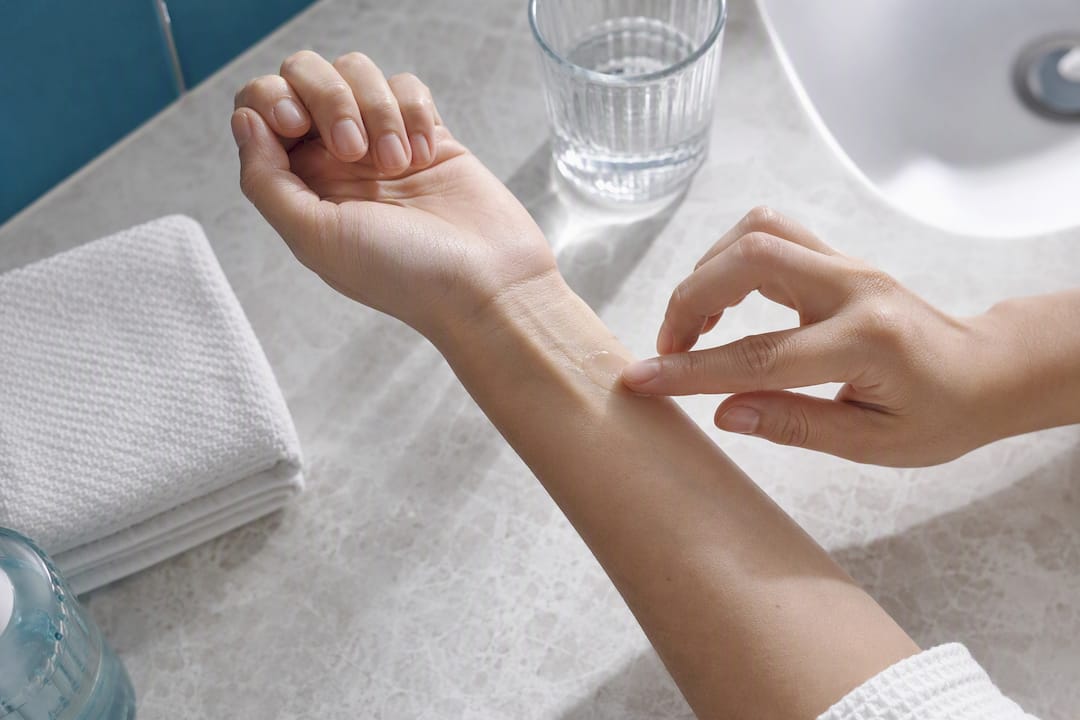 Patch testing facial oil on inner forearm