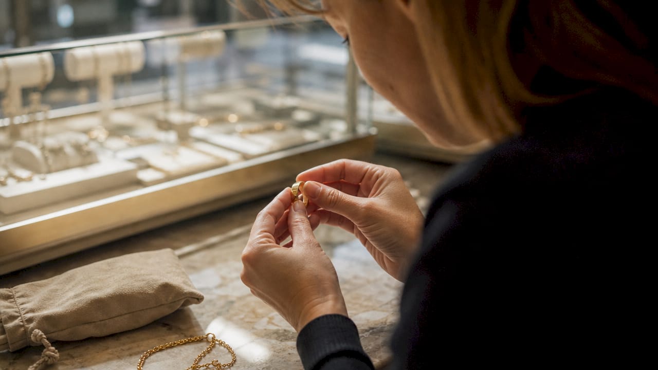 Close-up of hallmark on gold ring in jeweler's studio