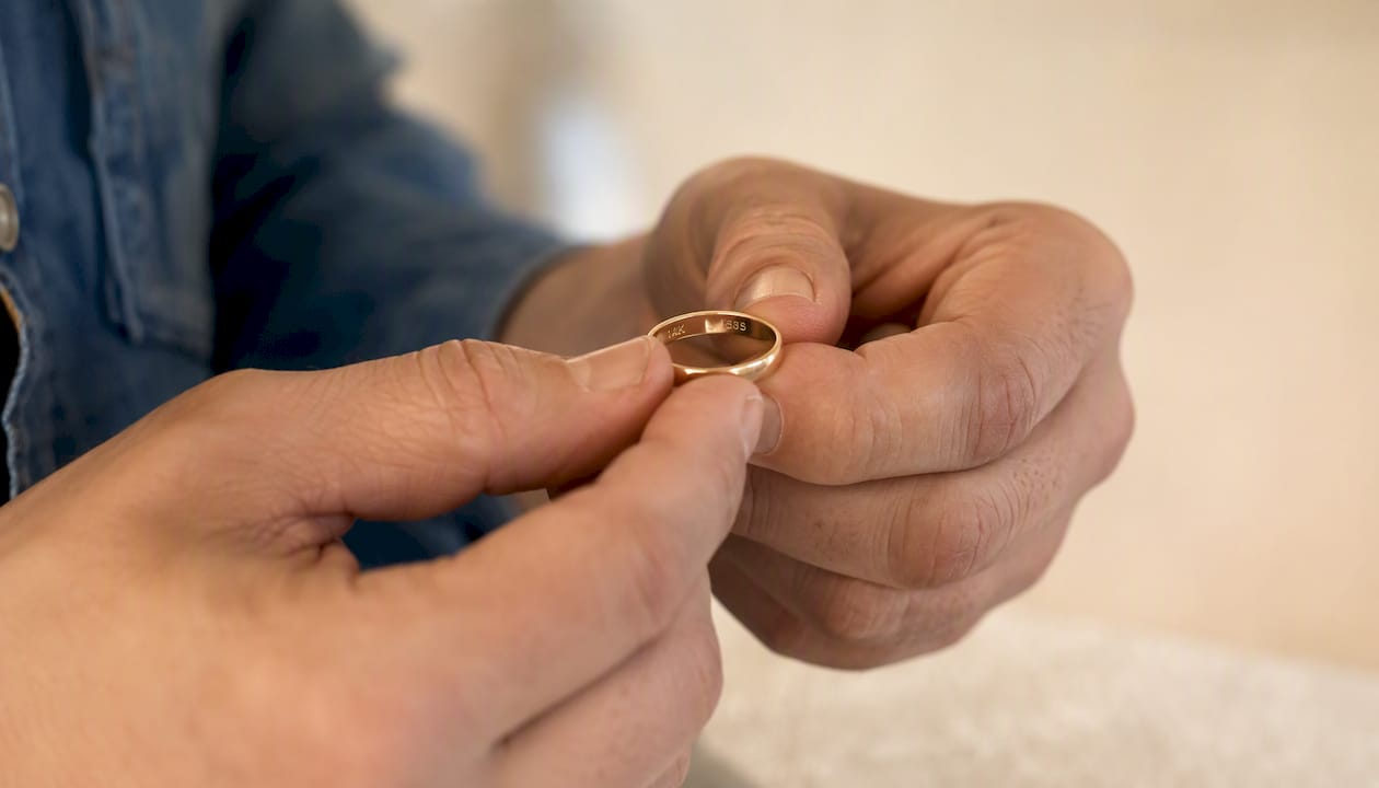 Close-up of gold ring with purity stamps