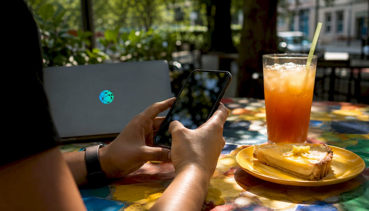 Hands scrolling digital product sales app in café