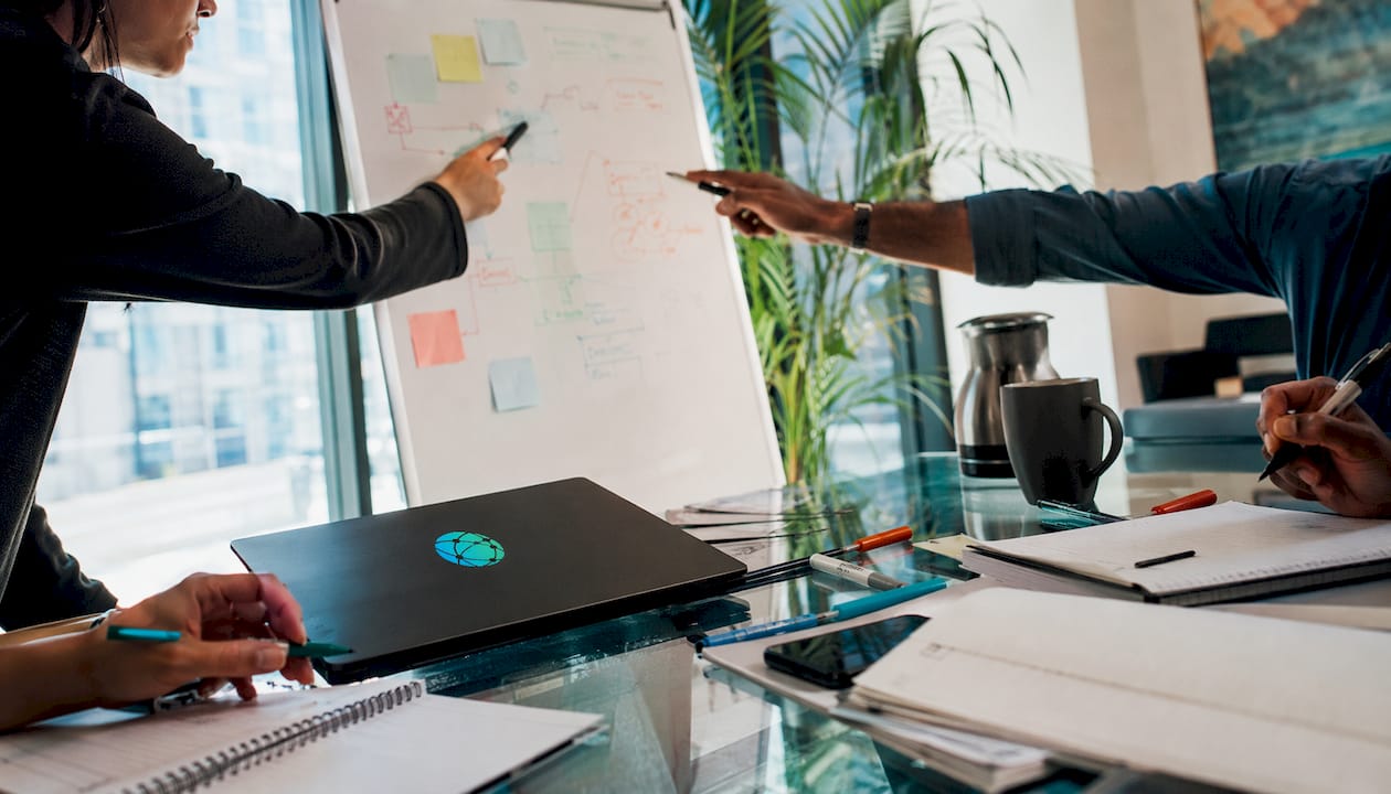 Hands collaborating on brand messaging plans