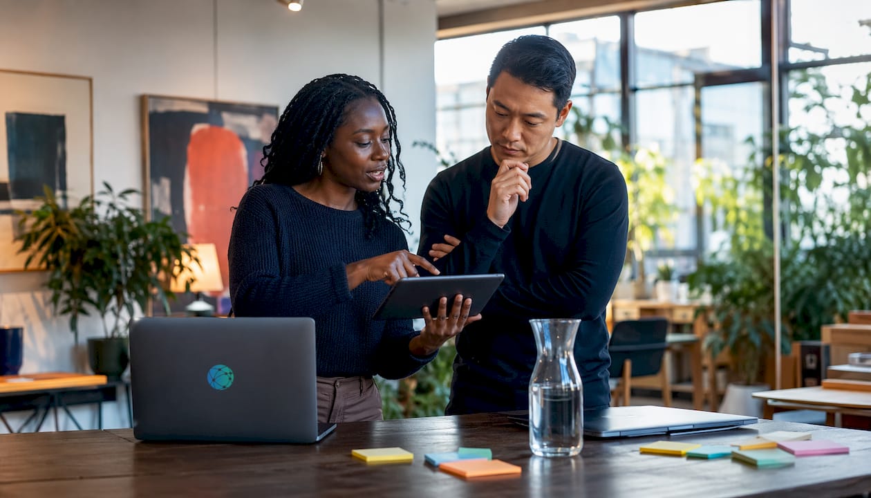 Colleagues discussing branded URL analytics