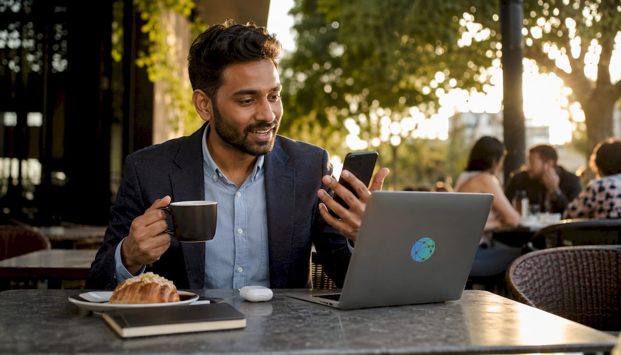 Creator discussing monetization options on video call in café