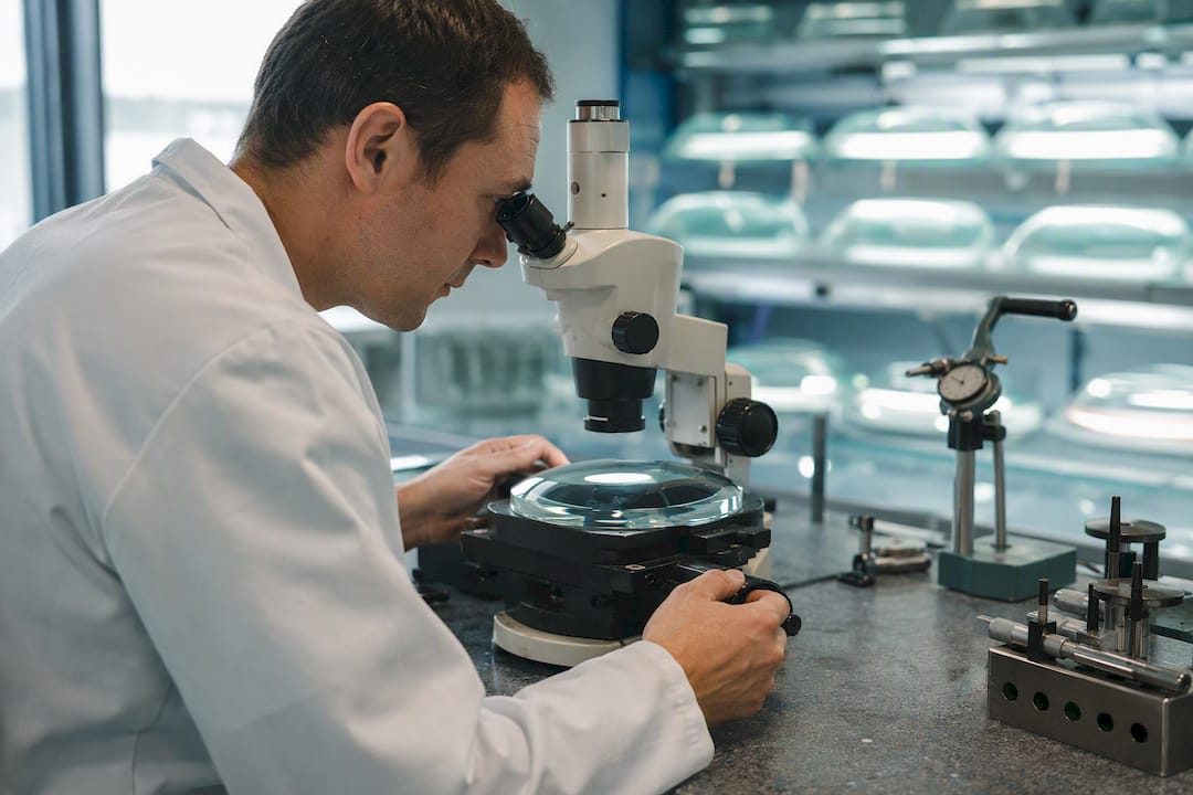 Lens curvature measured under microscope in manufacturing