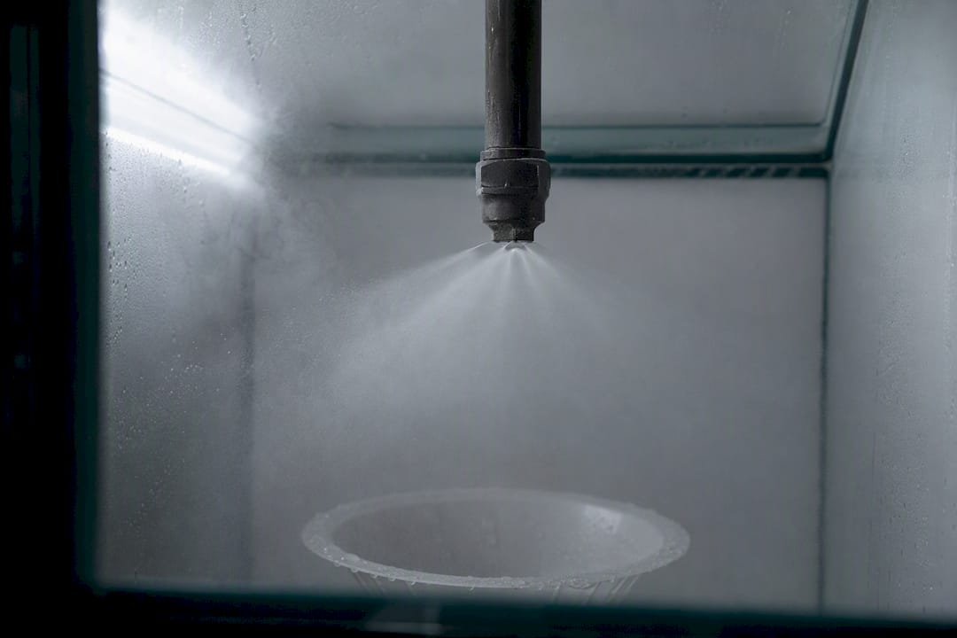 Close-up of atomiser nozzle spraying salt fog mist