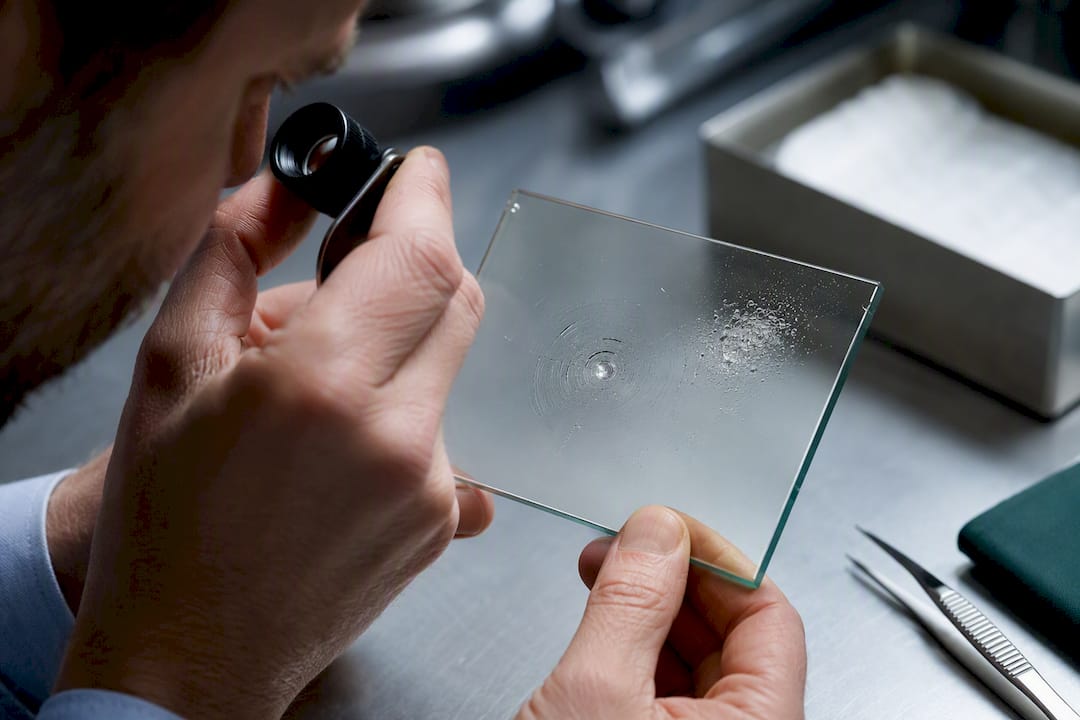 Ring cracking and pitting on coated glass