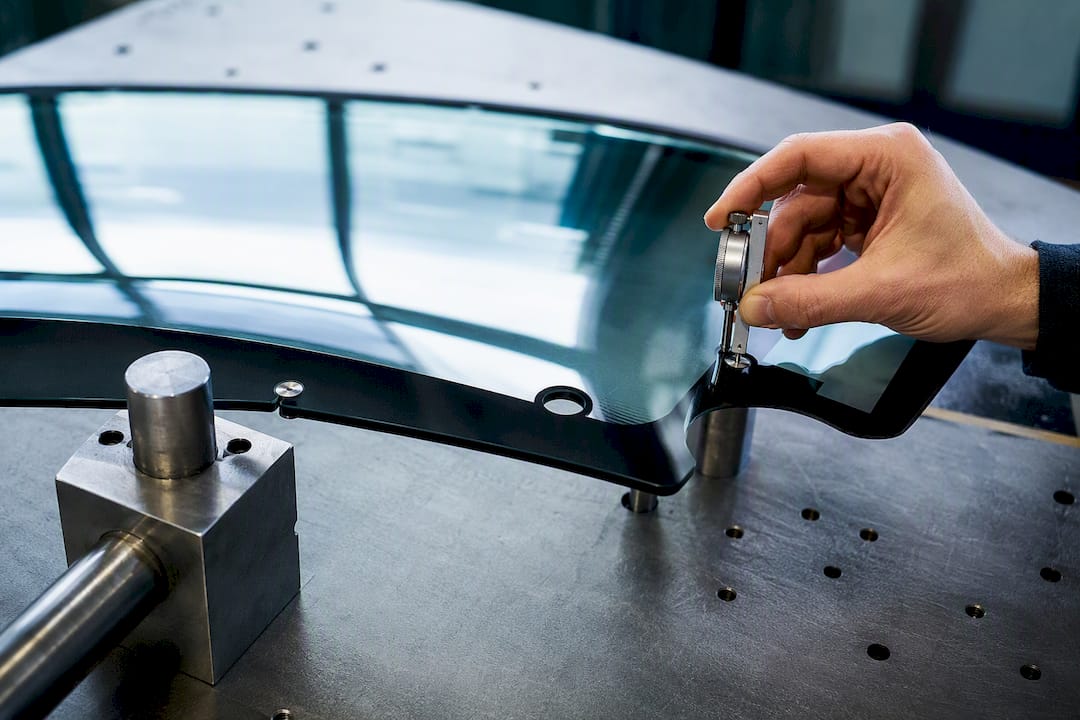 Curved glass edge undergoing tolerance inspection