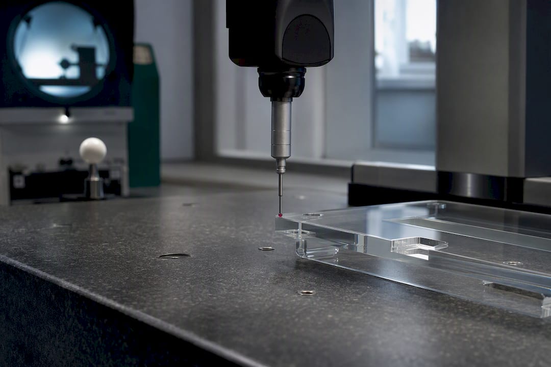 CMM probe inspecting glass prototype dimensions