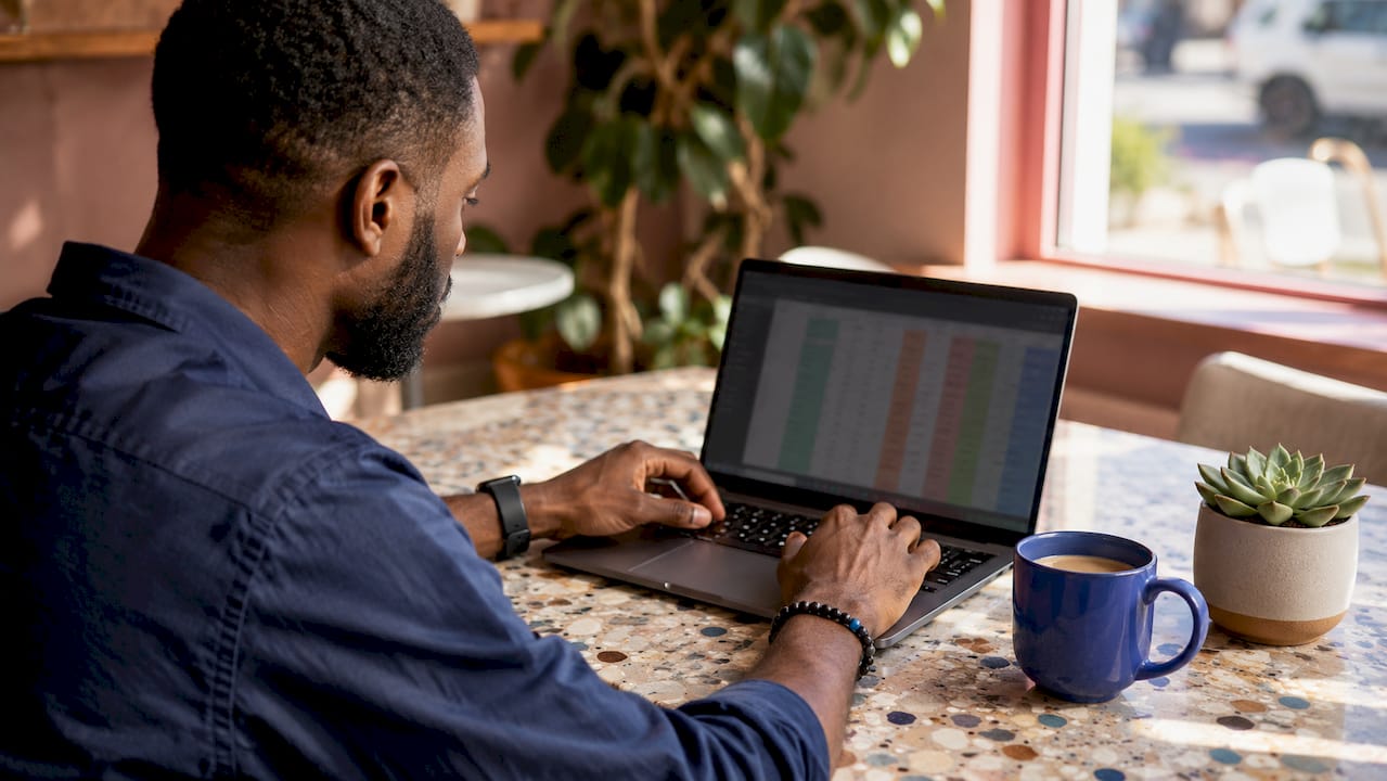 Overhead view of man analyzing social mentions data