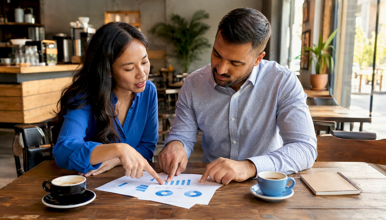 Colleagues discussing marketing channel strategies