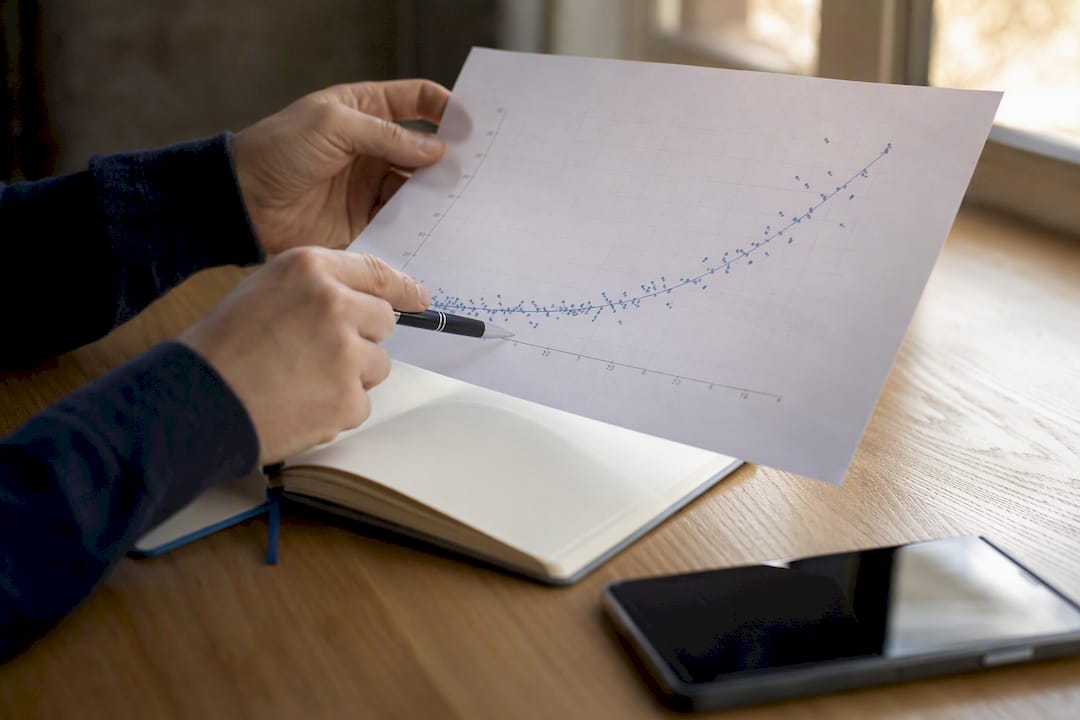Hands tracing website ranking charts