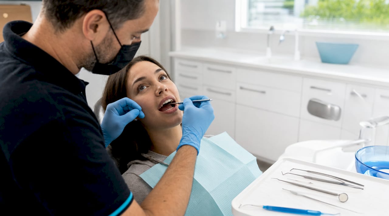 Dentist applying composite bonding to tooth