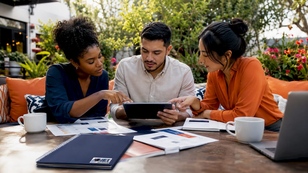 Marketing team collaborating around conference table