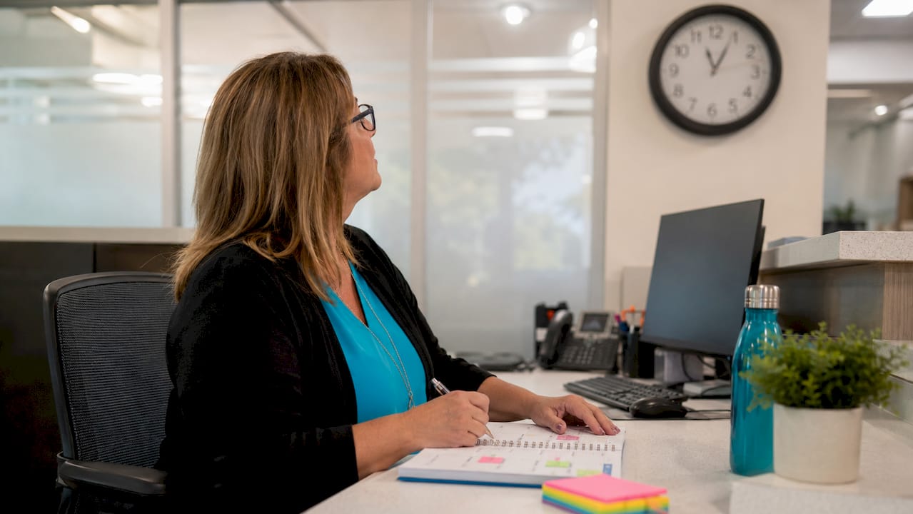 Dental receptionist managing appointment schedule