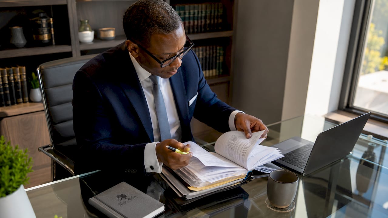 Lawyer examining real estate documents carefully