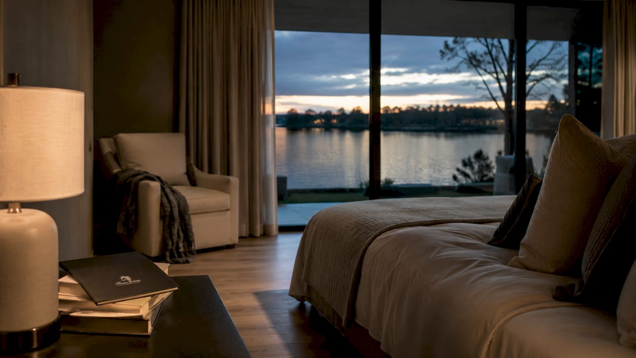 Staged bedroom with angled water view