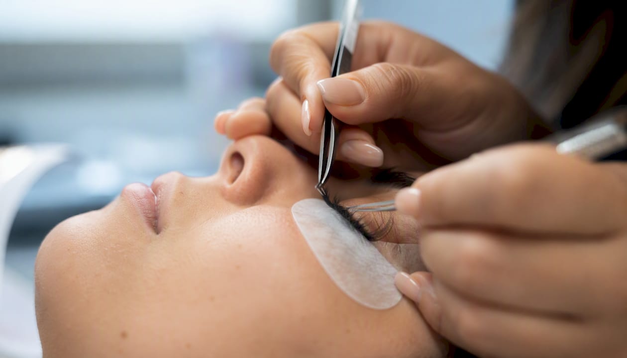 Close-up of eyelash extension application