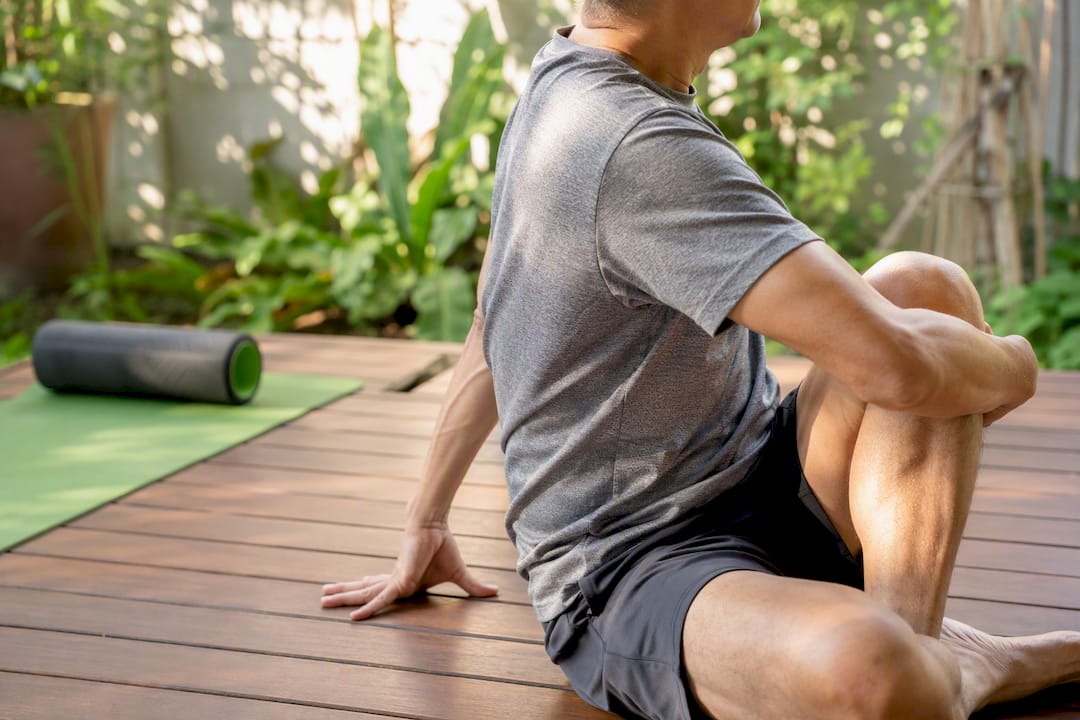 Torso twisting thoracic spine stretch in therapy studio