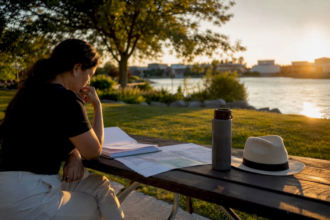 Investor reviewing property papers outdoors