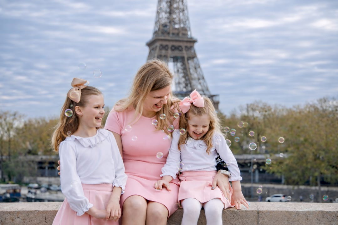 Photographer adjusting camera for family shoot