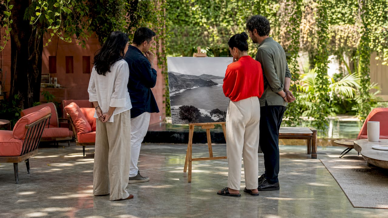 Visitors viewing famous landscape photo in gallery
