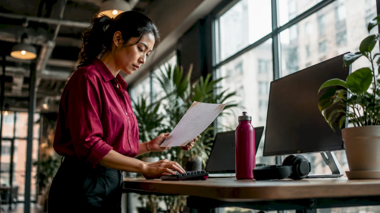 Woman conducting AI experiments at desk