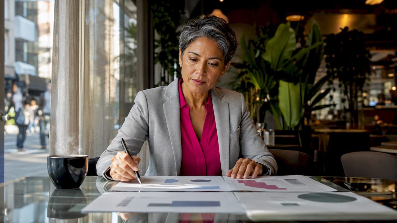 Executive woman reviewing AI strategy documents in office