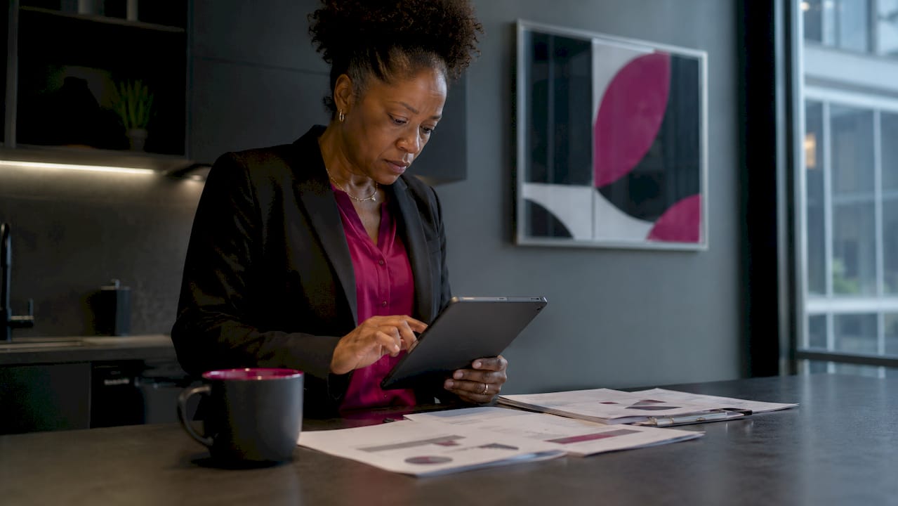 Woman reviewing AI Center of Excellence documents