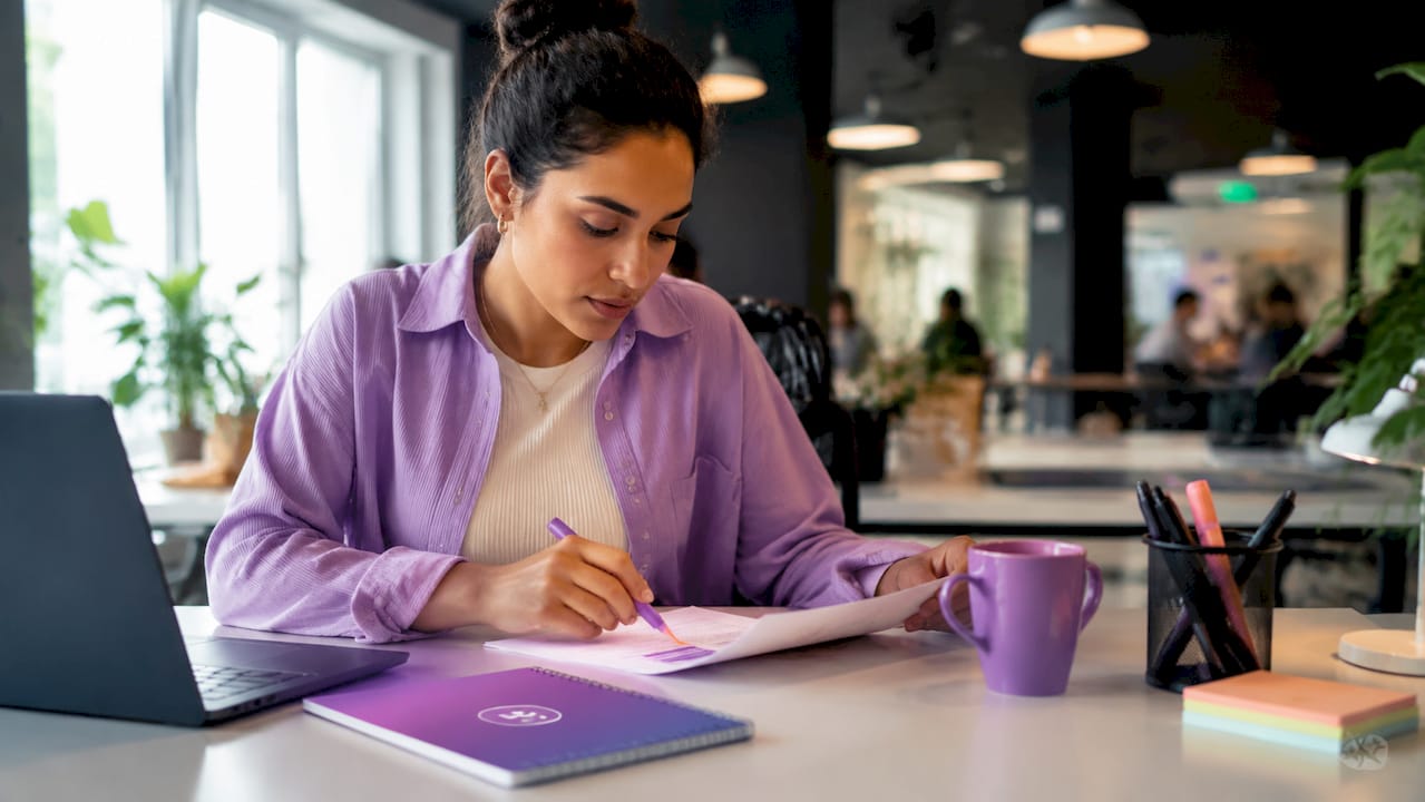 Person reviewing functional resume at home desk
