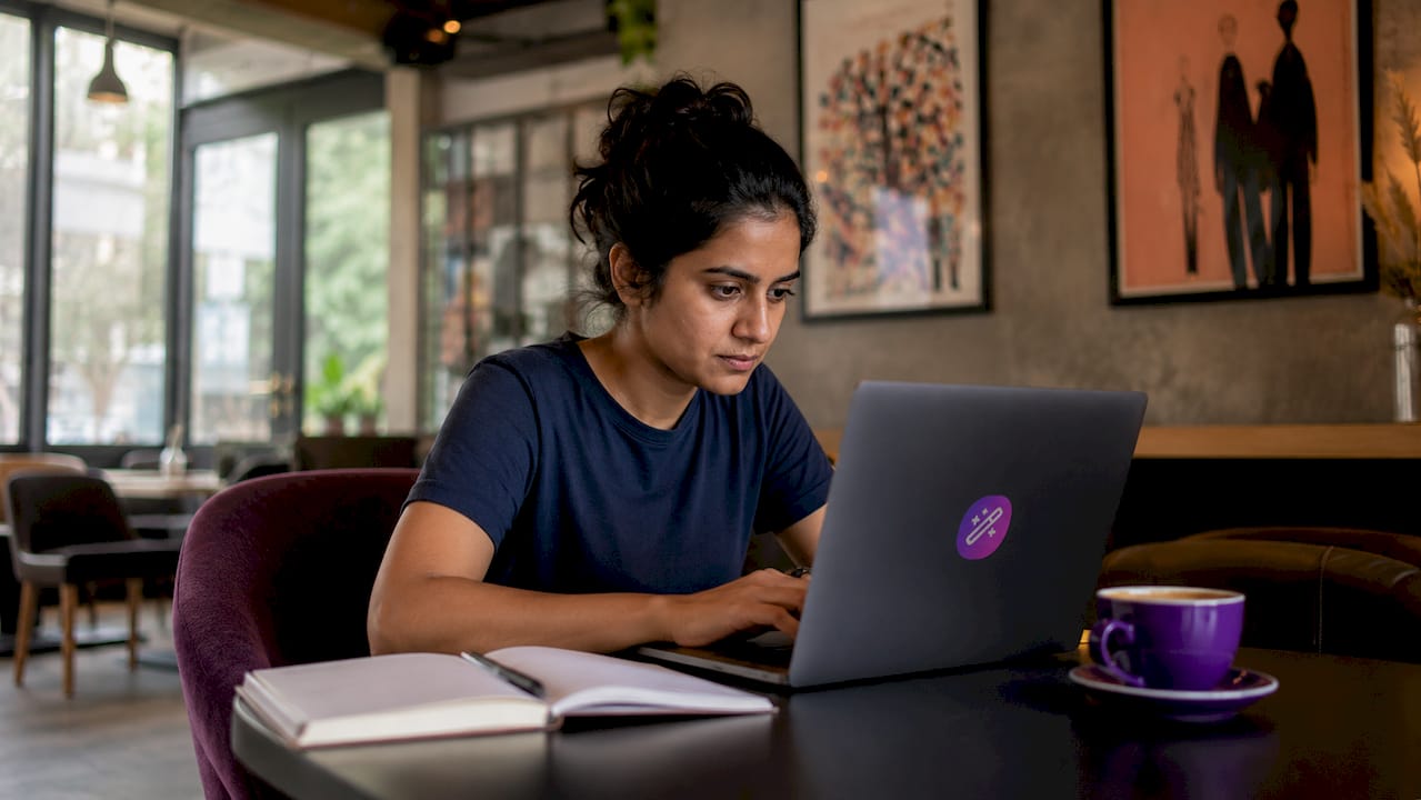 Woman working on resume parsing software code