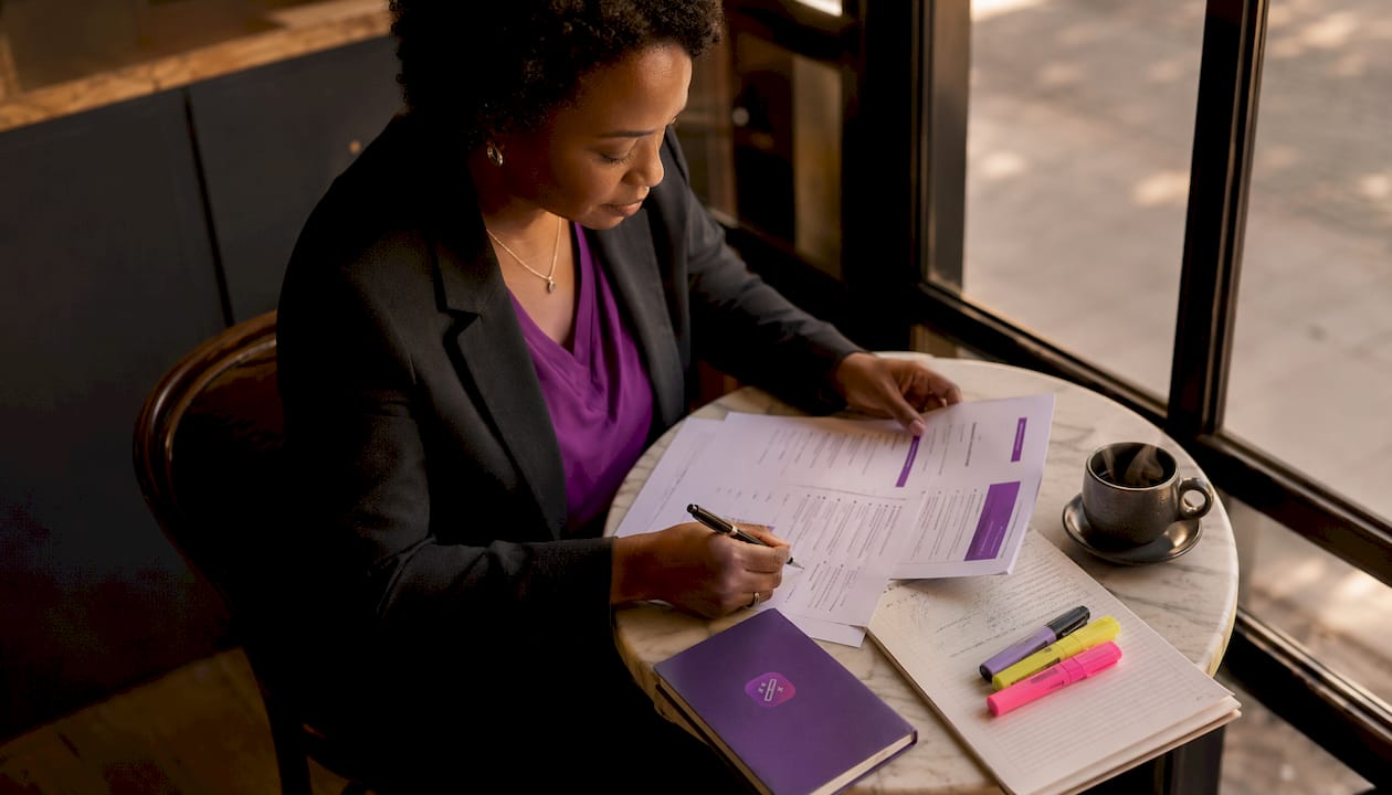 Woman reviewing resume examples in office