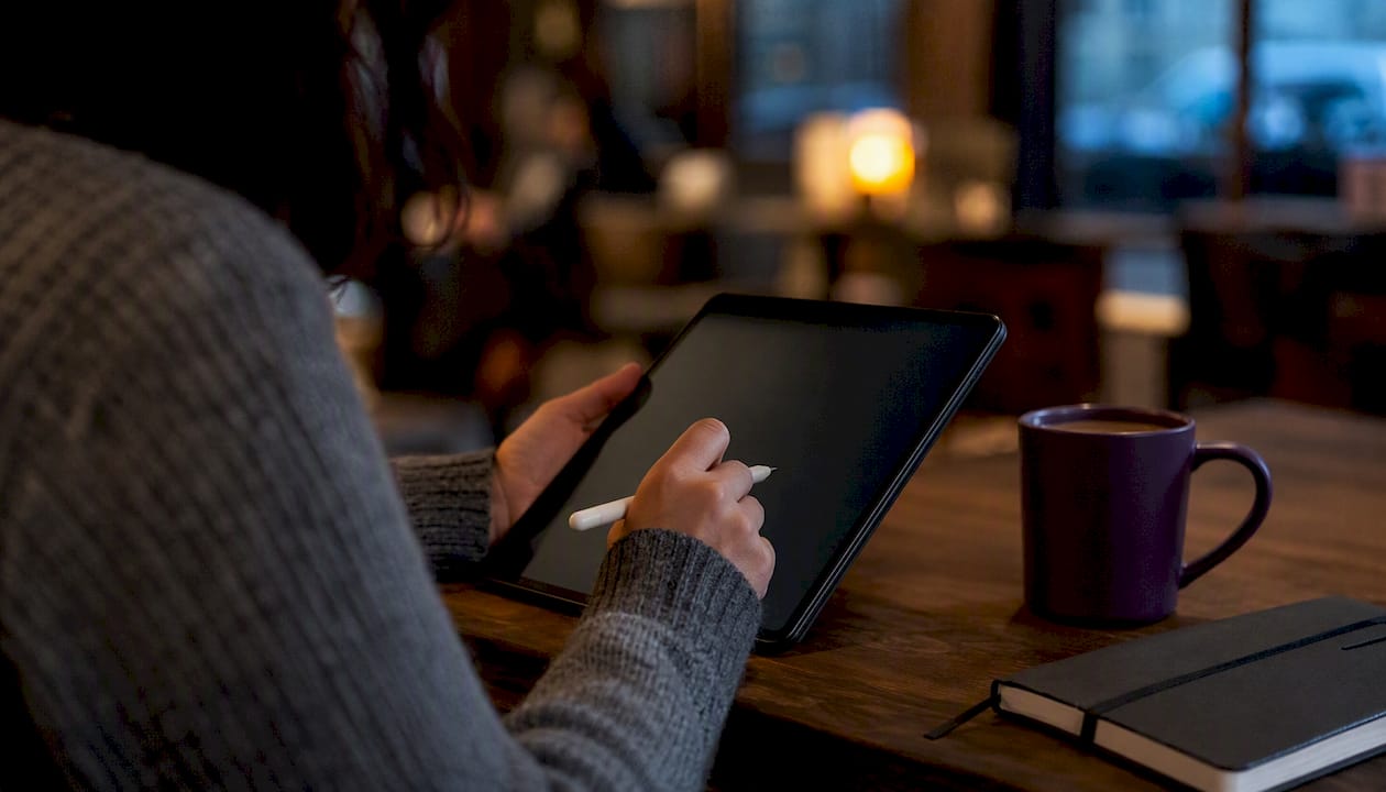 Hands cleaning data on tablet device