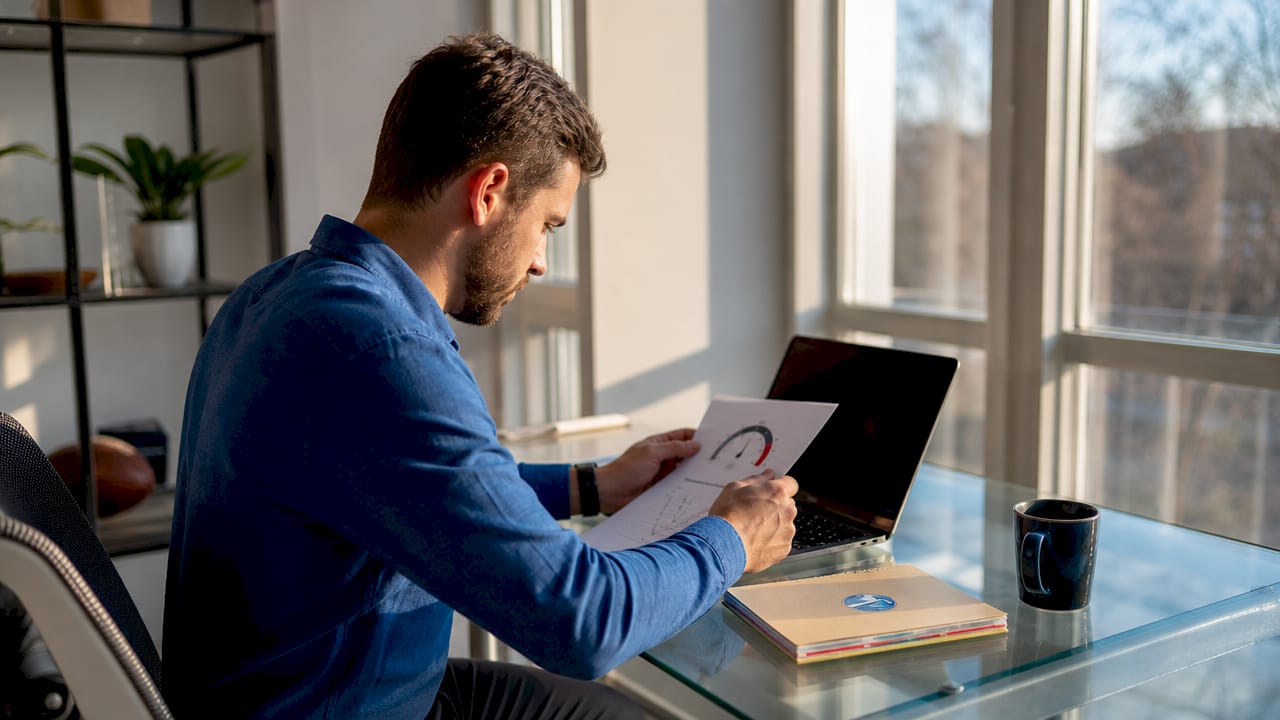 Small business owner reviewing website speed report