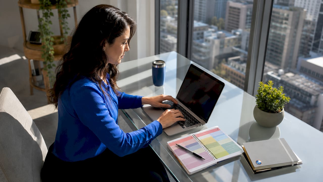 Woman using laptop to operate AI assistant