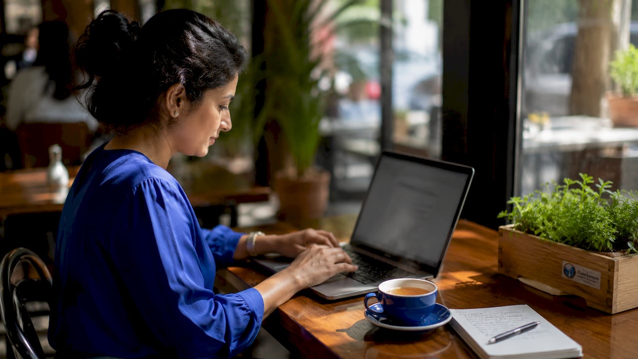 Woman working at laptop in home office
