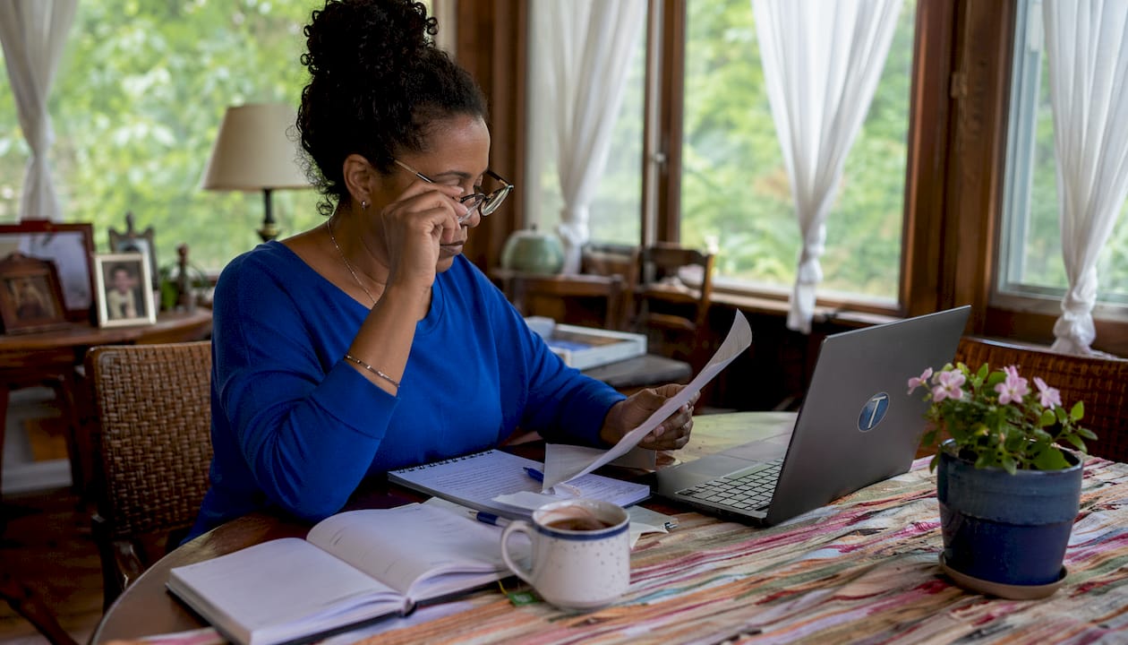 Agent managing real estate website at home office