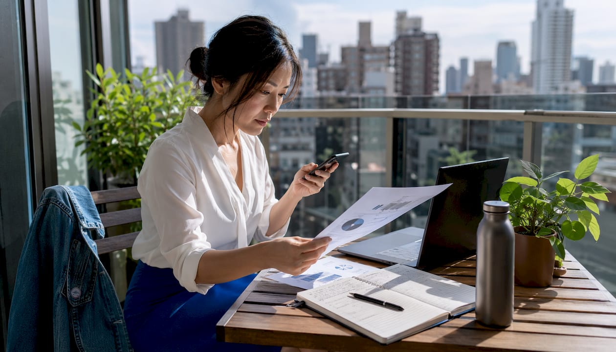 Businesswoman reviewing mobile SEO report