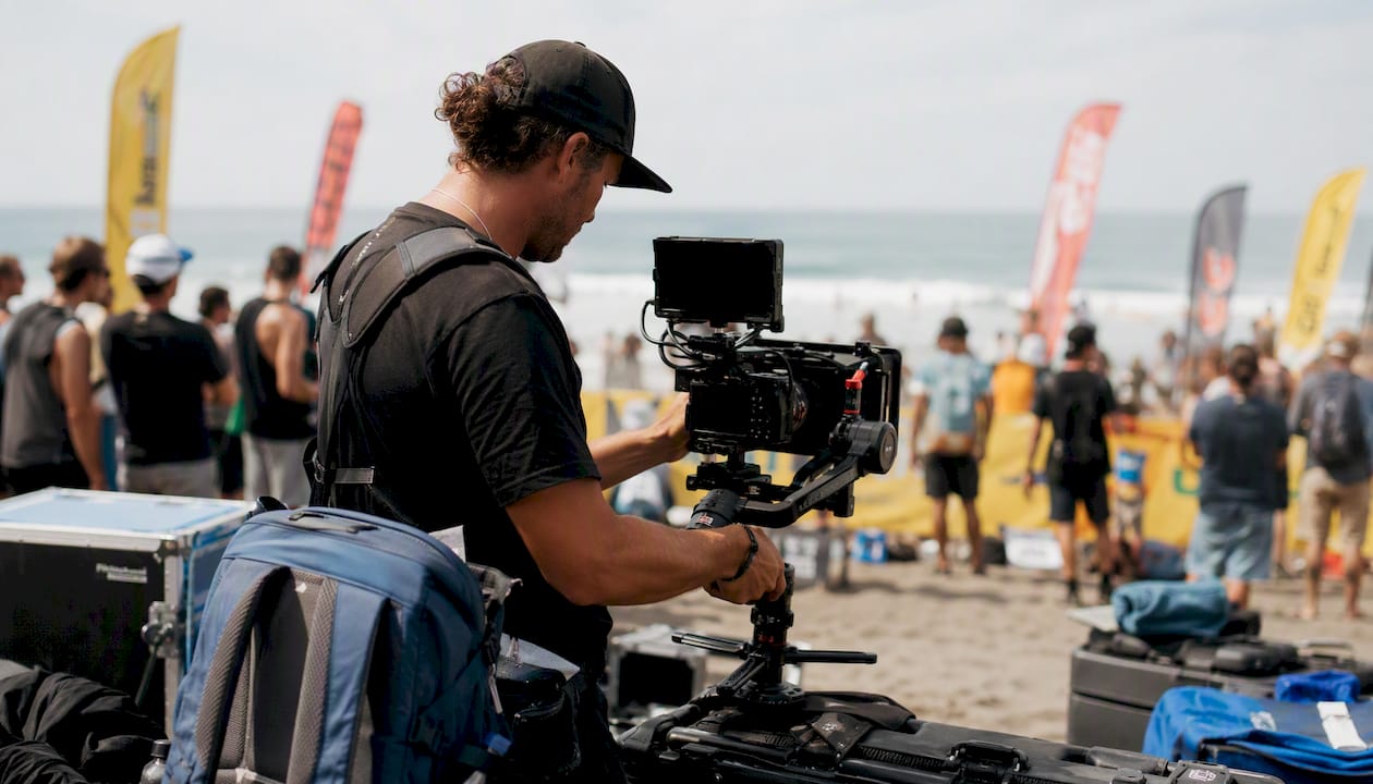Videographer filming extreme sports outdoors