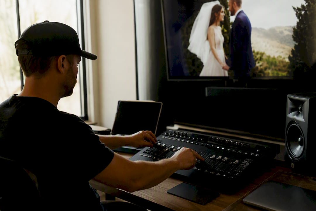 Hands balancing wedding video music volume