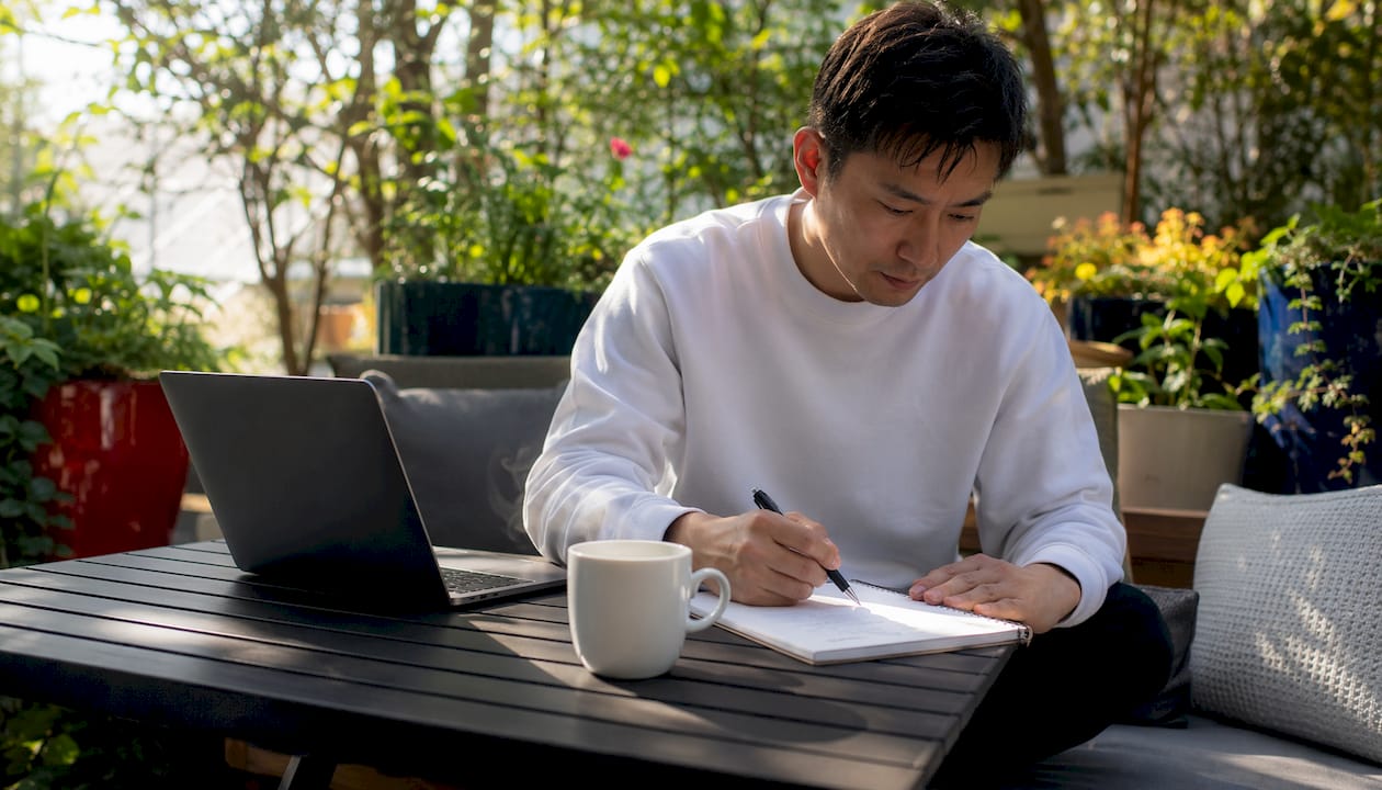 Creative professional typing brand voice guide at desk